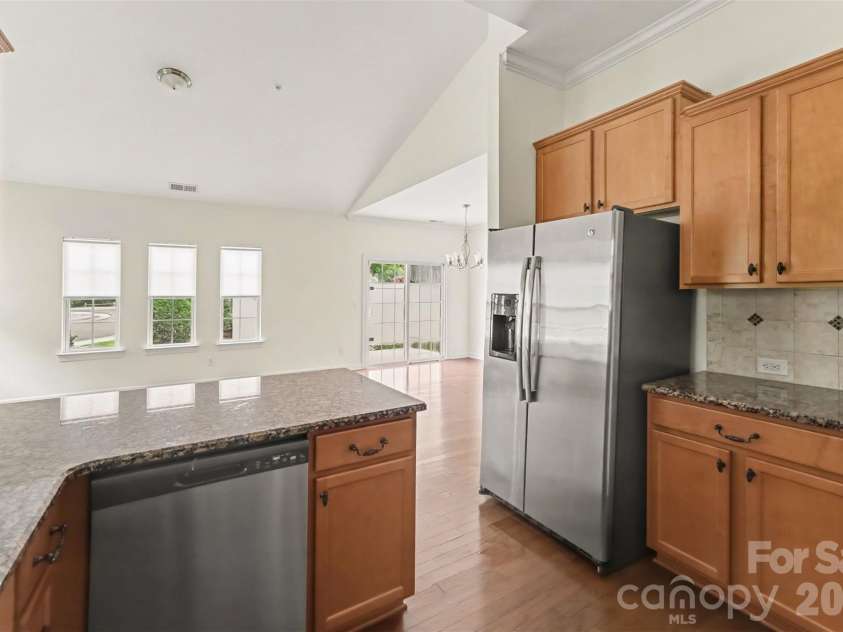 15109 Jade Street, Charlotte, NC 28277.  MLS# CAR4392614, YatesRealty ID 46948. Kitchen into living and dining