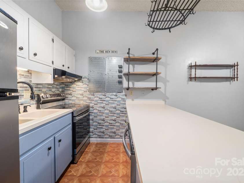 94 Market Street, Maggie Valley, NC 28751.  MLS# CAR4277066, YatesRealty ID 4695. Stainless appliances in the Large workspace in the kitchen