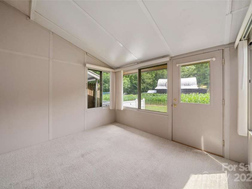 94 Market Street, Maggie Valley, NC 28751.  MLS# CAR4277066, YatesRealty ID 4695. View from the Sun Room adjoins the Coutry Kitchen - 