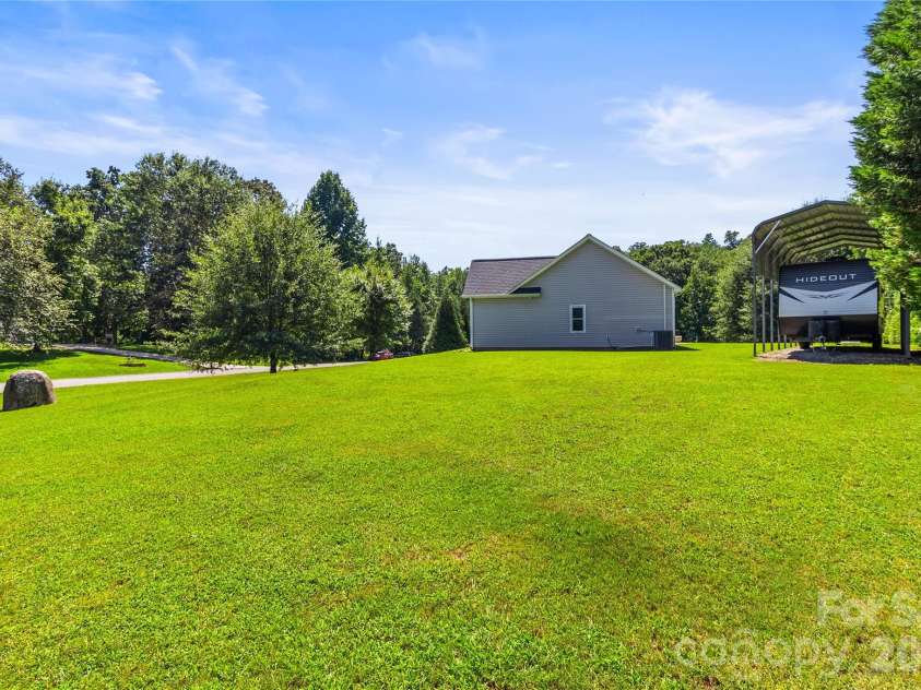 413 Summer Ridge Road, Stanley, NC 28164.  MLS# CAR4416198, YatesRealty ID 46951. Side yard