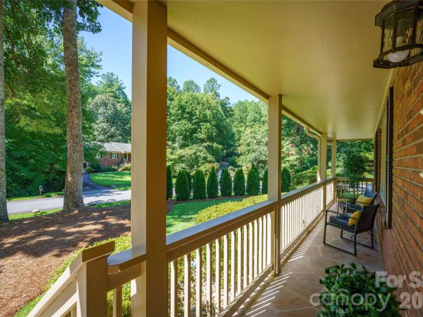 10 Surrey Run, Hendersonville, NC 28791.  MLS# CAR4416552, YatesRealty ID 46971. Front porch