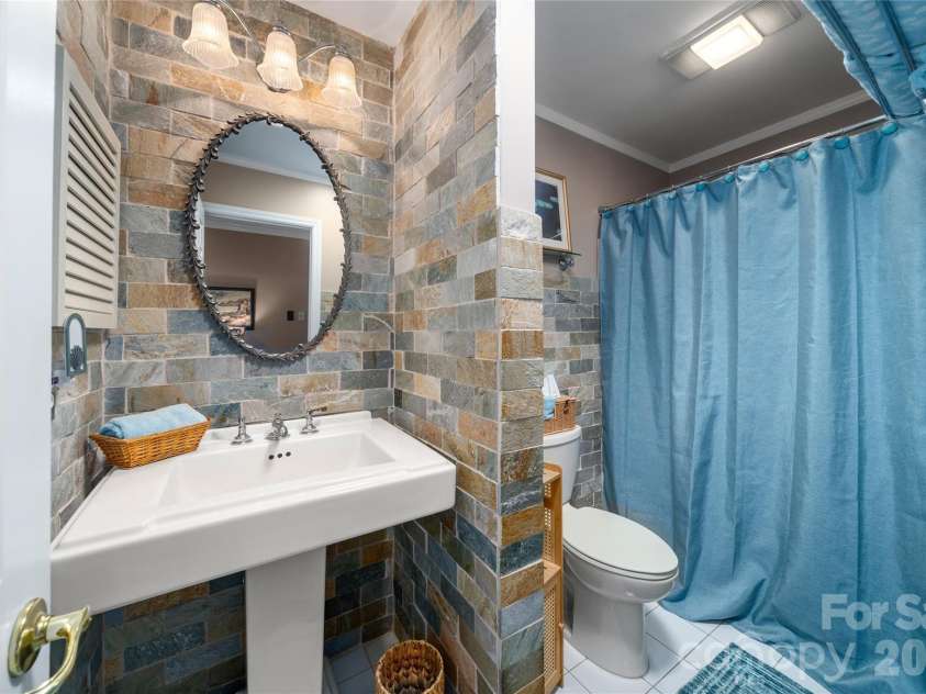 10 Surrey Run, Hendersonville, NC 28791.  MLS# CAR4416552, YatesRealty ID 46971. Hall Bathroom