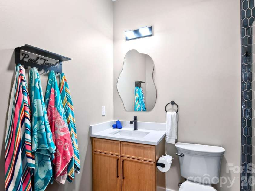 75 Boone Trail, Weaverville, NC 28787.  MLS# CAR4417076, YatesRealty ID 46979. A full bathroom, perfect for post-swim use