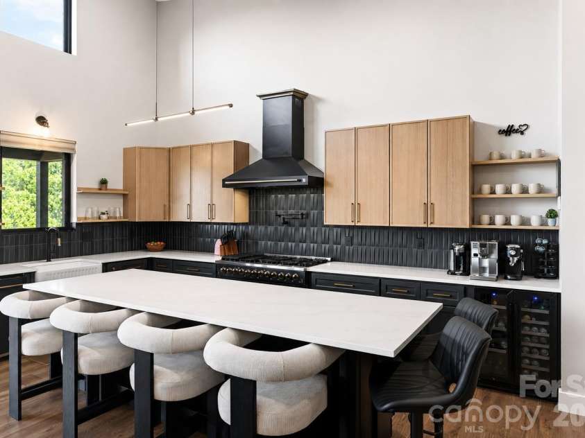 75 Boone Trail, Weaverville, NC 28787.  MLS# CAR4417076, YatesRealty ID 46979. An oversized kitchen island with seating for 6