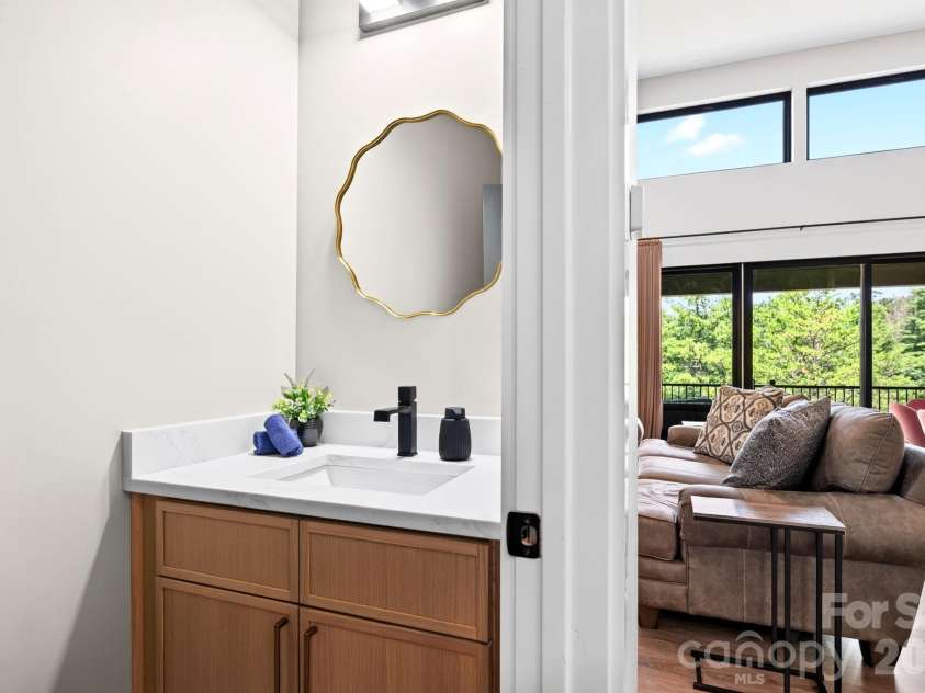 75 Boone Trail, Weaverville, NC 28787.  MLS# CAR4417076, YatesRealty ID 46979. Convenient main-level powder room keeps bedroom baths private