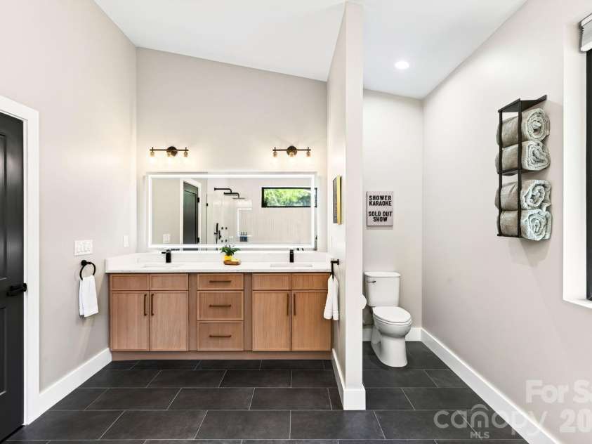 75 Boone Trail, Weaverville, NC 28787.  MLS# CAR4417076, YatesRealty ID 46979. Double sink vanity and separation from the commode