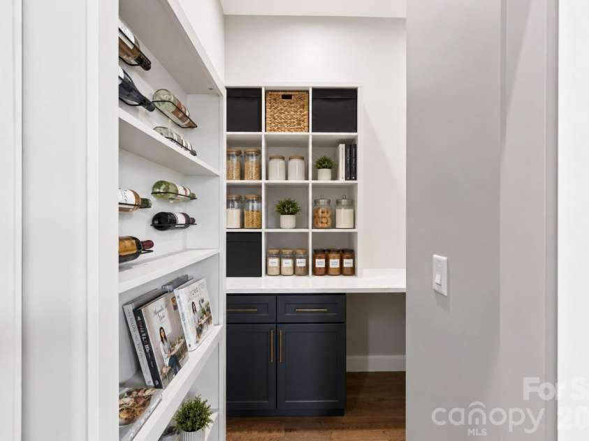 75 Boone Trail, Weaverville, NC 28787.  MLS# CAR4417076, YatesRealty ID 46979. Secret walk-in pantry offering an unexpected additional storage