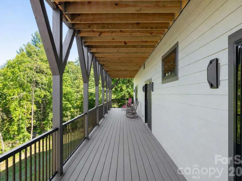75 Boone Trail, Weaverville, NC 28787.  MLS# CAR4417076, YatesRealty ID 46979. Two expansive full-length decks with durable, low-maintenance Trex decking