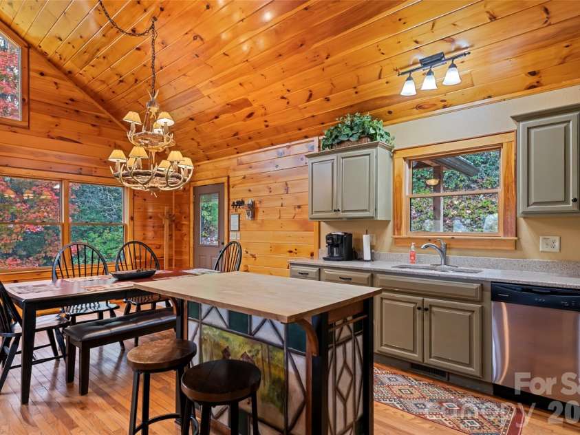 235 Soaring Eagle Road, Bryson City, NC 28713.  MLS# CAR4316418, YatesRealty ID 4698. Dining area and kitchen blend seamlessly into the great room making this an incredible place to entertain friends, family and/or guests