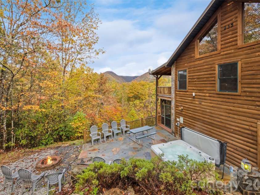 235 Soaring Eagle Road, Bryson City, NC 28713.  MLS# CAR4316418, YatesRealty ID 4698. Epic outdoor space with hot tub, outdoor furniture and fire pit 