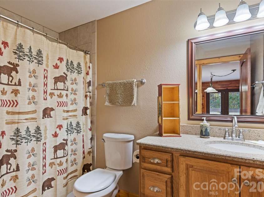 235 Soaring Eagle Road, Bryson City, NC 28713.  MLS# CAR4316418, YatesRealty ID 4698. Full bathroom downstairs located in game room 