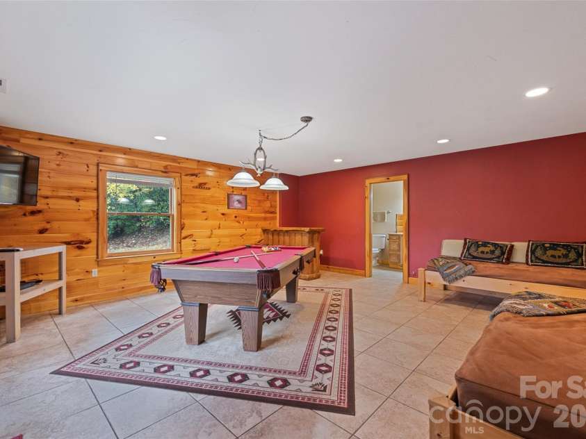 235 Soaring Eagle Road, Bryson City, NC 28713.  MLS# CAR4316418, YatesRealty ID 4698. Game room with included pool table, media center and full bathroom