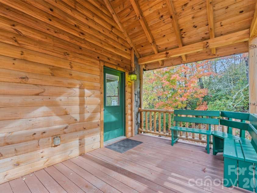 235 Soaring Eagle Road, Bryson City, NC 28713.  MLS# CAR4316418, YatesRealty ID 4698. Post and beam covered entry porch with built in bench