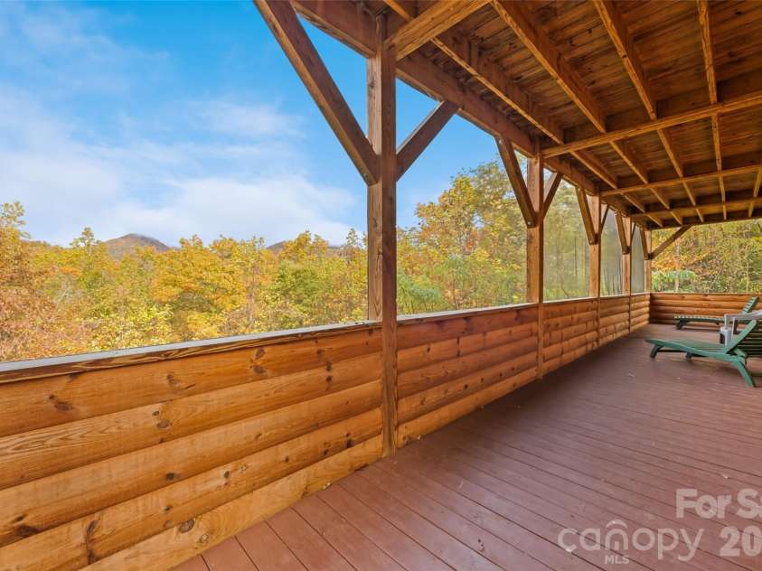 235 Soaring Eagle Road, Bryson City, NC 28713.  MLS# CAR4316418, YatesRealty ID 4698. Screened in porch on lower level with views of the National Park and access to outdoor space