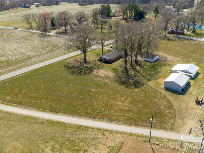 5803 Morgan Mill Road, Monroe, NC 28110.  MLS# CAR4352818, YatesRealty ID 4698. Ample tractor barn and sheds