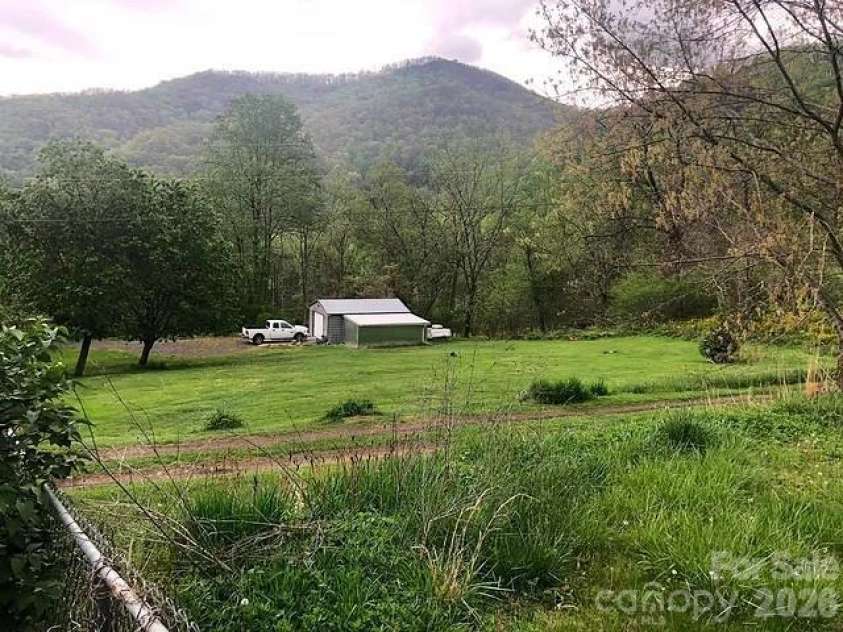 574 and 576 Paint Fork Road, Barnardsville, NC 28709.  MLS# CAR4418106, YatesRealty ID 46983. Large flat lot with garage 1