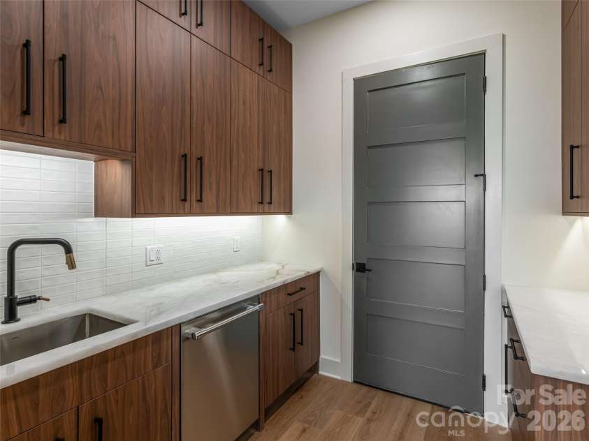 24 Watchman Drive, Hendersonville, NC 28791.  MLS# CAR4215455, YatesRealty ID 4699. Back Kitchen with 2nd dishwasher. Direct and zero step access from Garage