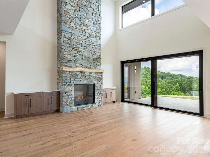 24 Watchman Drive, Hendersonville, NC 28791.  MLS# CAR4215455, YatesRealty ID 4699. Family Room - 14 ft European Glass Doors 