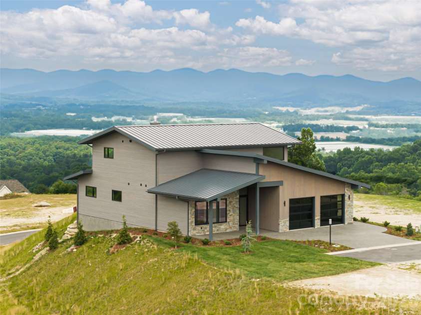 24 Watchman Drive, Hendersonville, NC 28791.  MLS# CAR4215455, YatesRealty ID 4699. Gorgeous layered mountain views await!