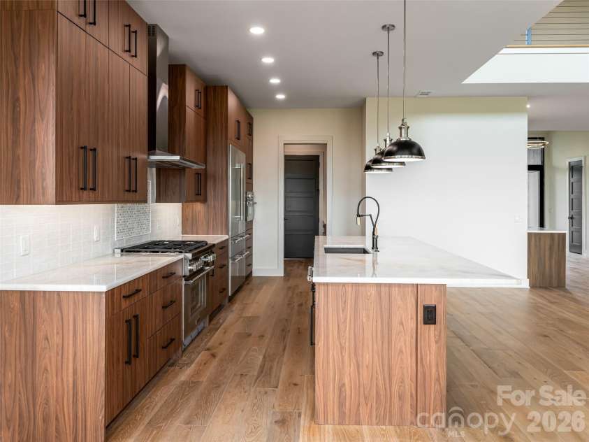 24 Watchman Drive, Hendersonville, NC 28791.  MLS# CAR4215455, YatesRealty ID 4699. Kitchen - Beautiful Quartzite Countertops 