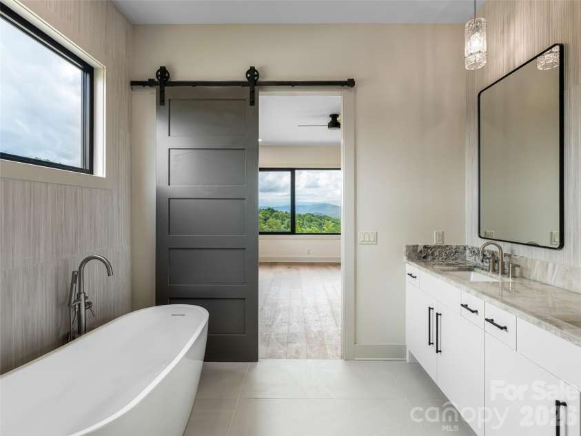 24 Watchman Drive, Hendersonville, NC 28791.  MLS# CAR4215455, YatesRealty ID 4699. Primary Bedroom with soaker tub