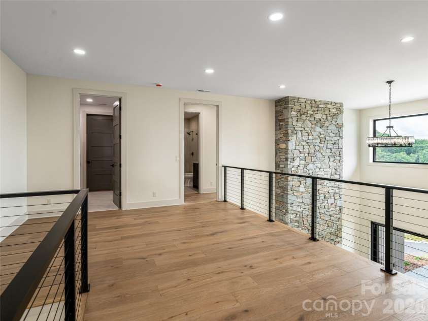 24 Watchman Drive, Hendersonville, NC 28791.  MLS# CAR4215455, YatesRealty ID 4699. Upstairs Family Room / Mezzanine