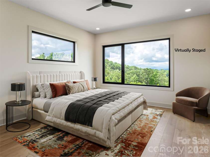 24 Watchman Drive, Hendersonville, NC 28791.  MLS# CAR4215455, YatesRealty ID 4699. Virtually Staged Primary Bedroom with XL windows showcasing layered mountain views
