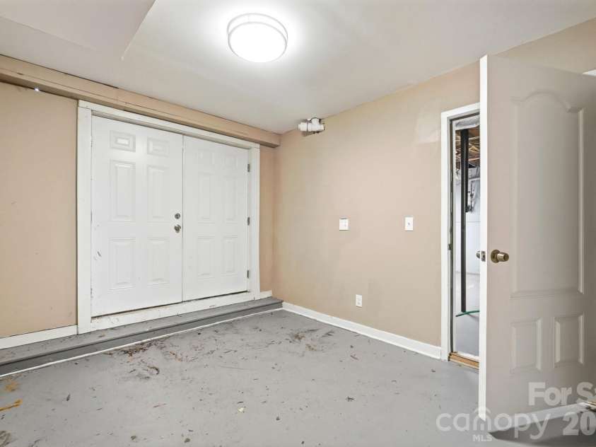 317 4th Avenue, Gastonia, NC 28054.  MLS# CAR4415299, YatesRealty ID 47005. Entry way to expansive basement