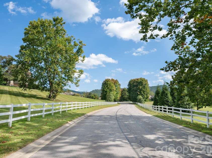 31 Bradford Vistas Drive, Fletcher, NC 28732.  MLS# CAR4303470, YatesRealty ID 4703. Amenties include a security gate, walking trails, and lovely entrance