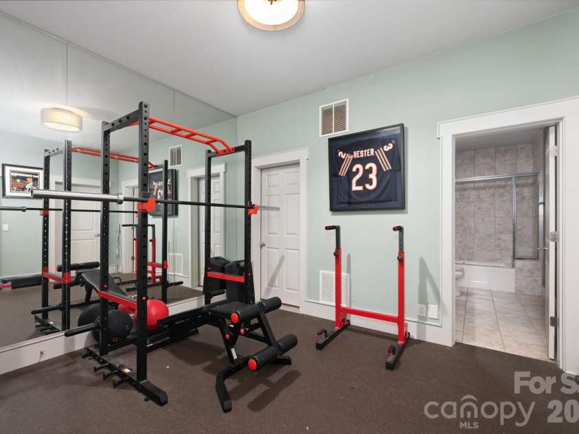 31 Bradford Vistas Drive, Fletcher, NC 28732.  MLS# CAR4303470, YatesRealty ID 4703. Lower level gym