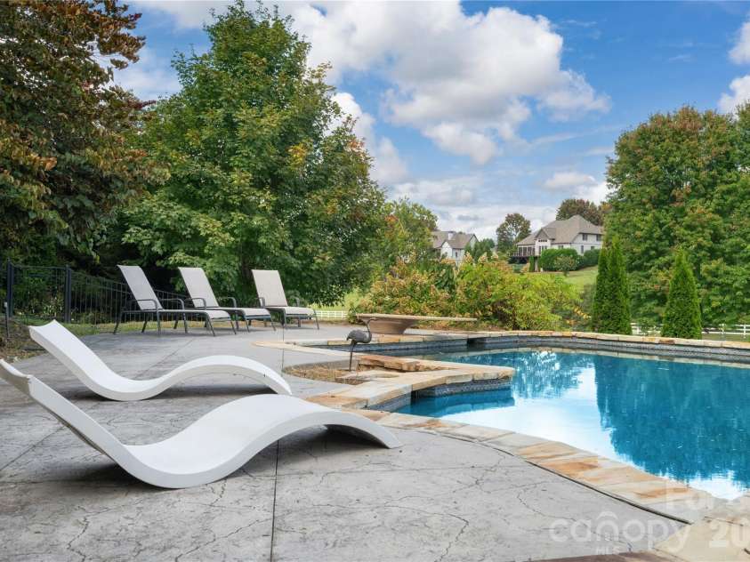 31 Bradford Vistas Drive, Fletcher, NC 28732.  MLS# CAR4303470, YatesRealty ID 4703. Mature landscaping gives tons of privacy