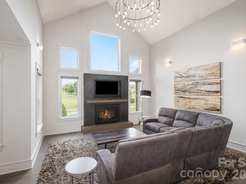 31 Bradford Vistas Drive, Fletcher, NC 28732.  MLS# CAR4303470, YatesRealty ID 4703. Vaulted ceiling living room with cozy gas fireplace