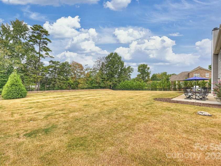 8011 Caliterra Drive, Charlotte, NC 28227.  MLS# CAR4241034, YatesRealty ID 4703. Back Yard and Patio