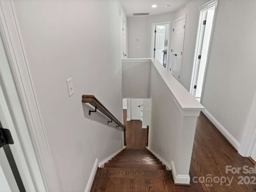 8011 Caliterra Drive, Charlotte, NC 28227.  MLS# CAR4241034, YatesRealty ID 4703. Staircase and Upstairs Hallway