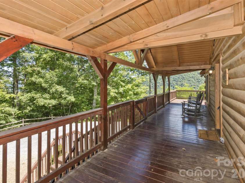 153 Tall Oaks Drive, Maggie Valley, NC 28751.  MLS# CAR4418740, YatesRealty ID 47031. Covered front porch on the main level.