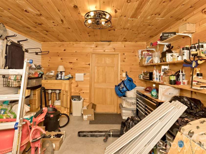 153 Tall Oaks Drive, Maggie Valley, NC 28751.  MLS# CAR4418740, YatesRealty ID 47031. Finished/heated storage area.
