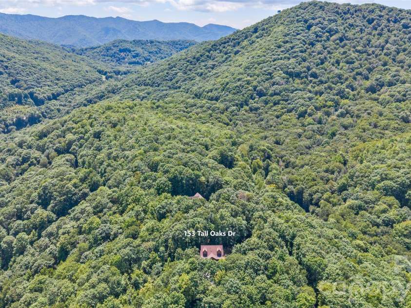 153 Tall Oaks Drive, Maggie Valley, NC 28751.  MLS# CAR4418740, YatesRealty ID 47031. Lush, long range views.