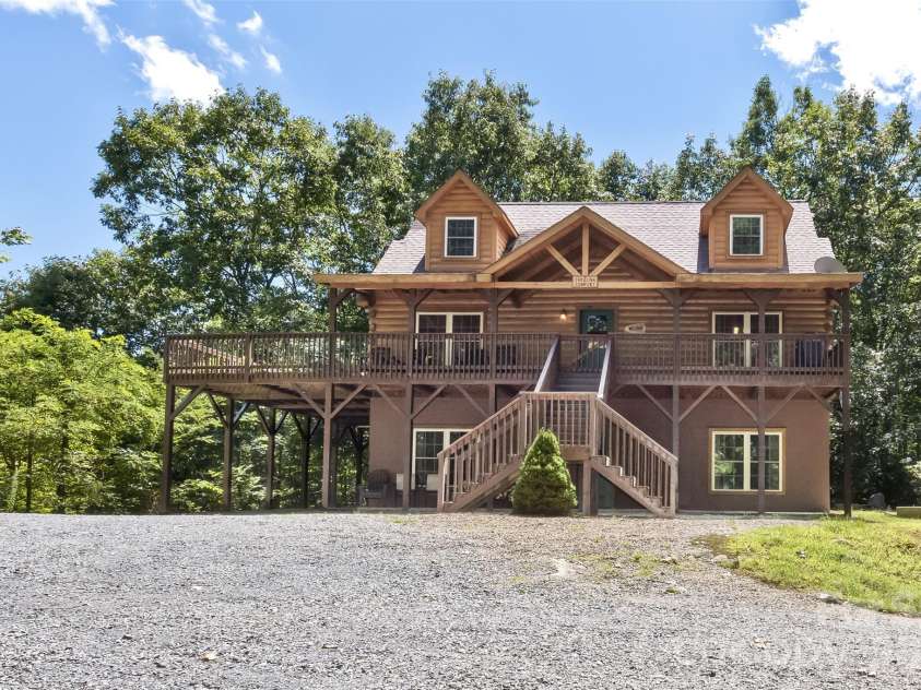 153 Tall Oaks Drive, Maggie Valley, NC 28751.  MLS# CAR4418740, YatesRealty ID 47031. Perched on a level area with plentiful parking and beautiful surroundings!