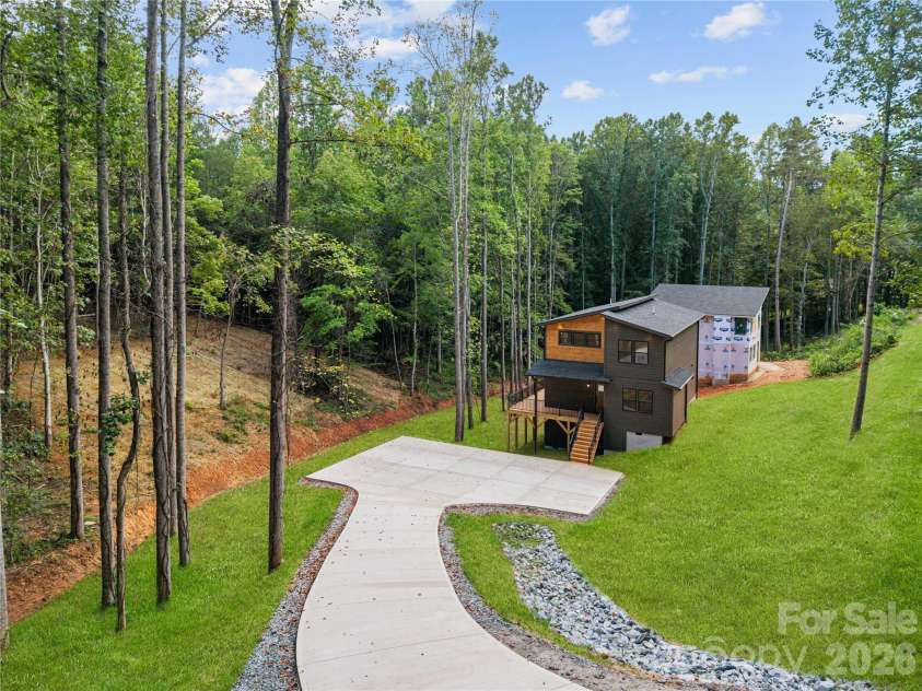 129 Quiet Woods Drive, Leicester, NC 28748.  MLS# CAR4417531, YatesRealty ID 47047. Virtually enhanced grass