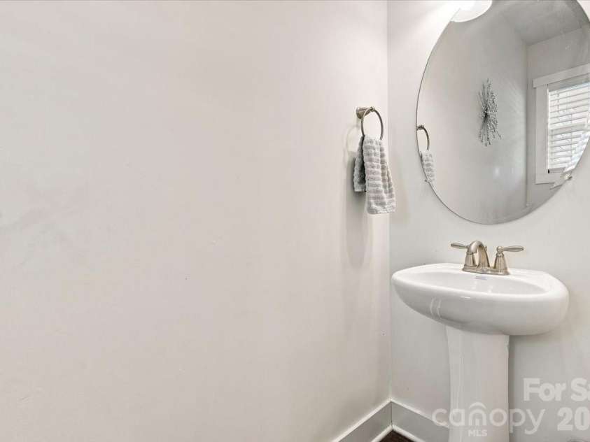15 Hyde Park Place, Arden, NC 28704.  MLS# CAR4416533, YatesRealty ID 47055. Half bath for guests on main