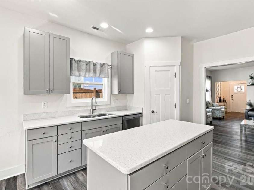 15 Hyde Park Place, Arden, NC 28704.  MLS# CAR4416533, YatesRealty ID 47055. Pantry next to the dishwasher