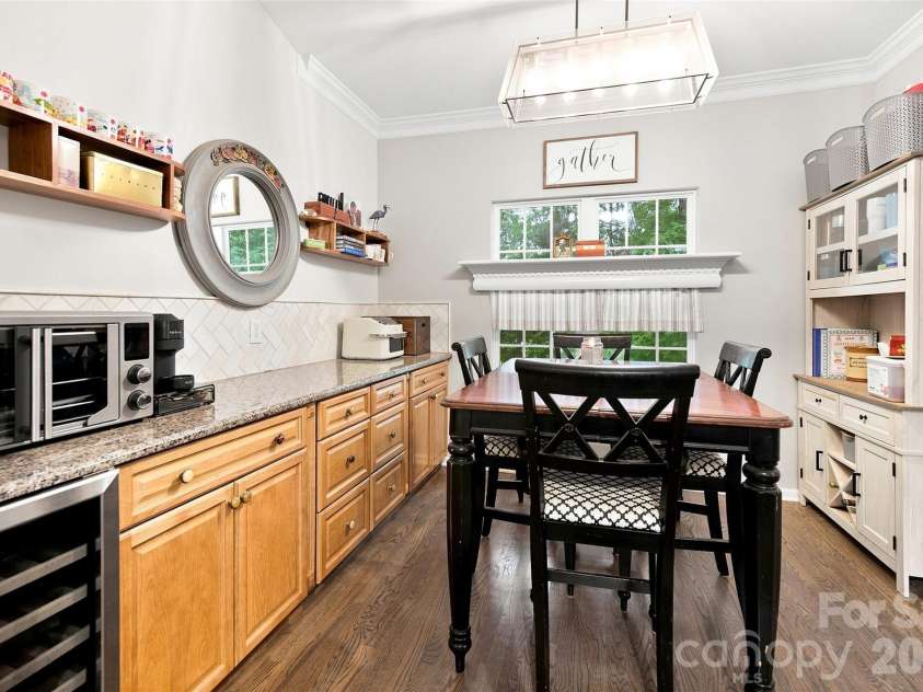 439 Glencrest Drive, Stanley, NC 28164.  MLS# CAR4415116, YatesRealty ID 47073. Dining area off Kitchen features built-in extra cabinetry w/granite countertop. Separate Formal Dining Room off LR.
