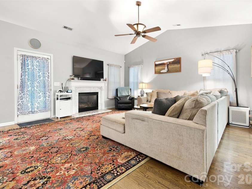 439 Glencrest Drive, Stanley, NC 28164.  MLS# CAR4415116, YatesRealty ID 47073. Living Room features include vaulted ceiling and gas fireplace-perfect for those cold winter nights.