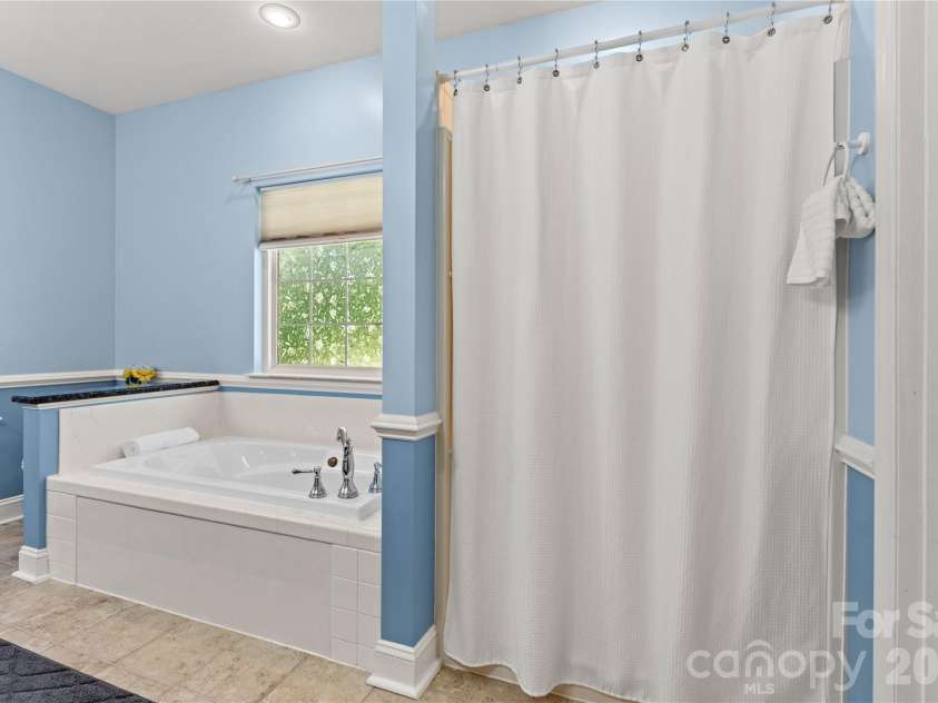 2017 Cameron Heights Circle, Denver, NC 28037.  MLS# CAR4410904, YatesRealty ID 47075. Separate walk-in shower with seat.