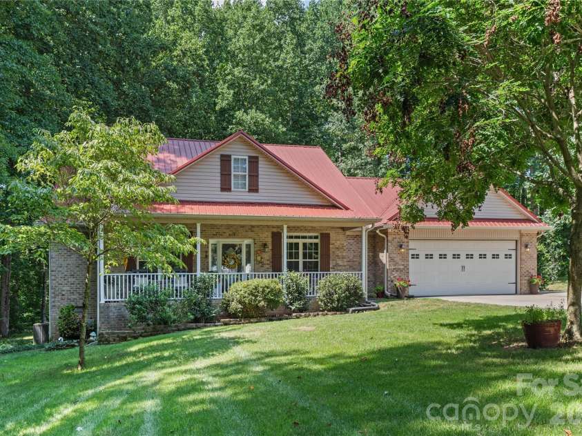2017 Cameron Heights Circle, Denver, NC 28037.  MLS# CAR4410904, YatesRealty ID 47075. Welcome home to this charming one-level home with a maintenance free exterior.  Positioned even further back from the street with long driveway lined with trees.