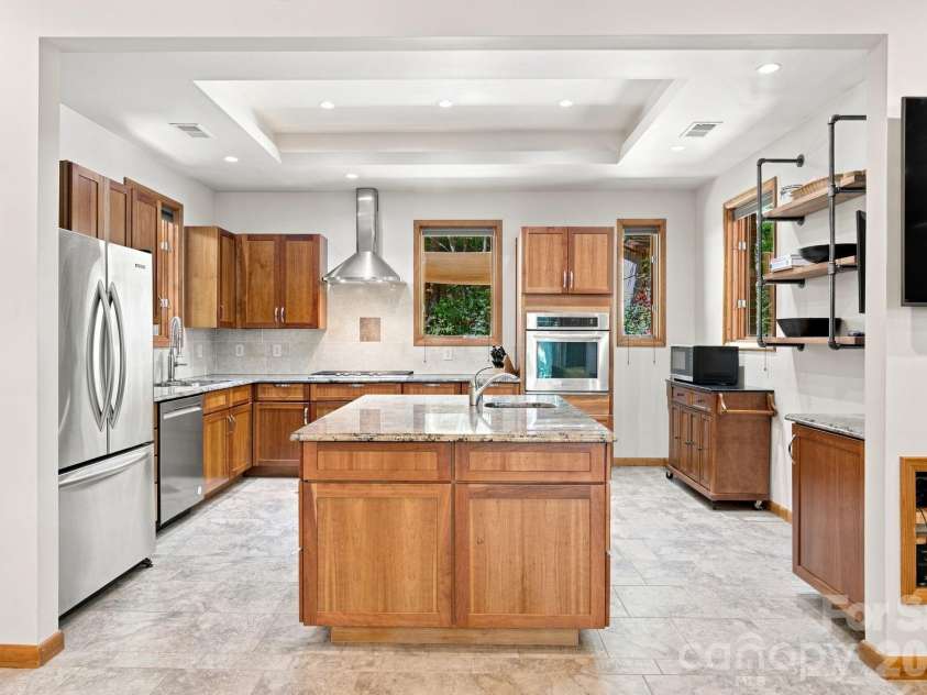 316 Riverwood Road, Mooresville, NC 28117.  MLS# CAR4414932, YatesRealty ID 47076. Kitchen with Cherry cabinets