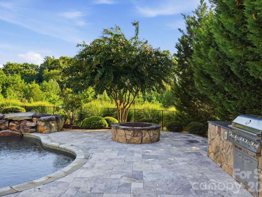 120 Eagles Landing Drive, Mooresville, NC 28117.  MLS# CAR4416069, YatesRealty ID 47082. Built-in grill and fire pit