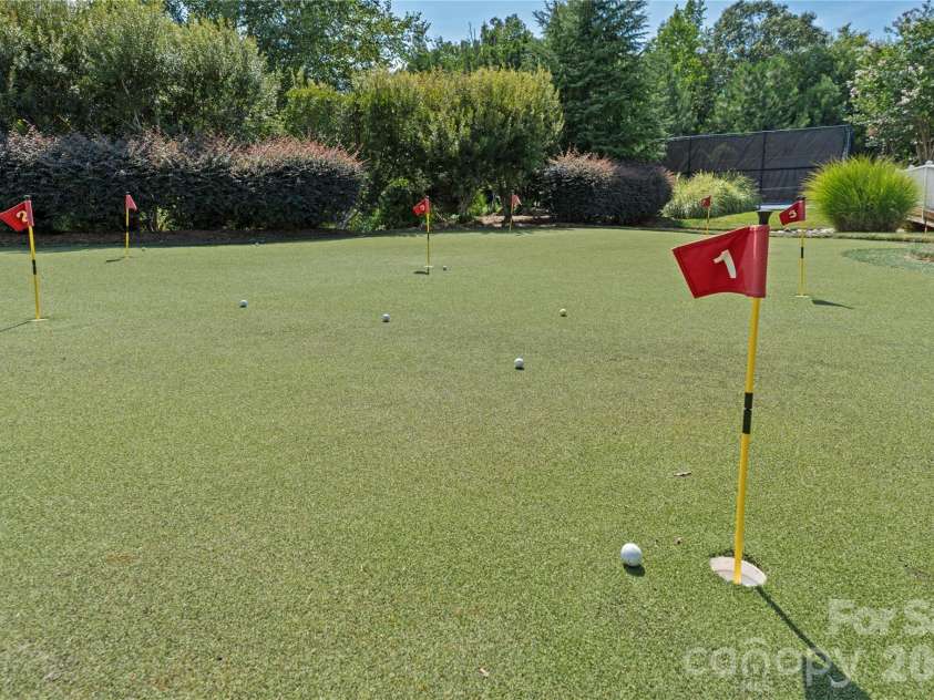 12701 Meetinghouse Drive, Cornelius, NC 28031.  MLS# CAR4415803, YatesRealty ID 47083. Putting green!