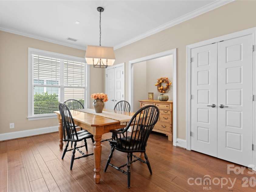12701 Meetinghouse Drive, Cornelius, NC 28031.  MLS# CAR4415803, YatesRealty ID 47083. Spacious dining room with niche and two closets with custom shelving for storing dinnerware or large appliances.