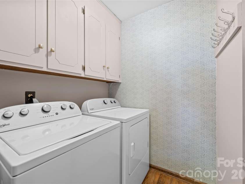 8800 Glencroft Road, Charlotte, NC 28227.  MLS# CAR4416112, YatesRealty ID 47087. Laundry room with updated appliances